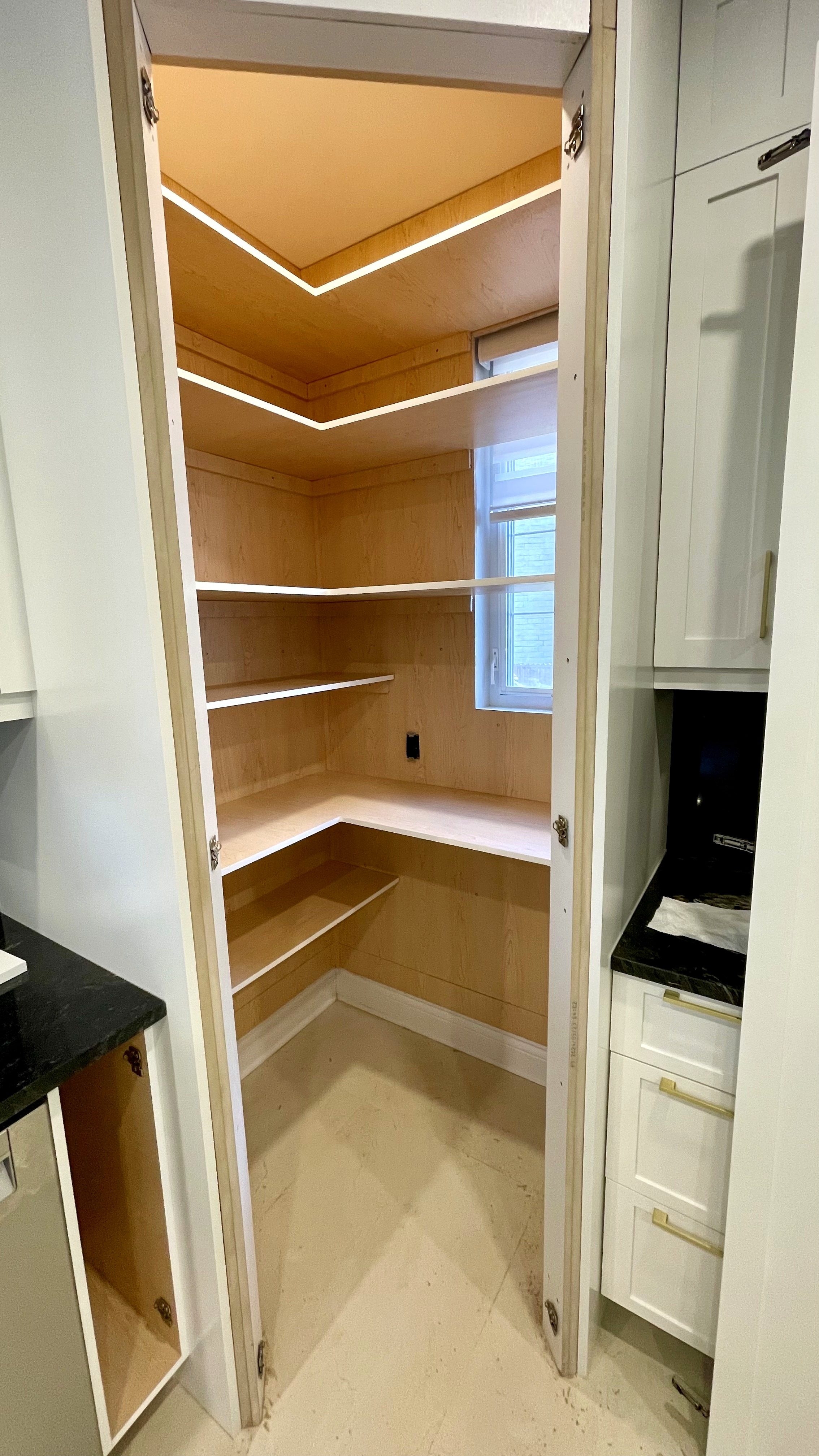 Custom maple storage — natural wood grain left visible